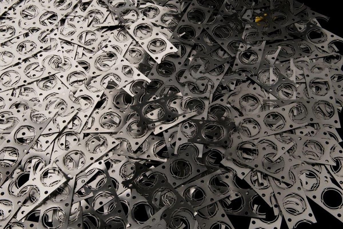 Carrier strip left after stamped parts are cut free