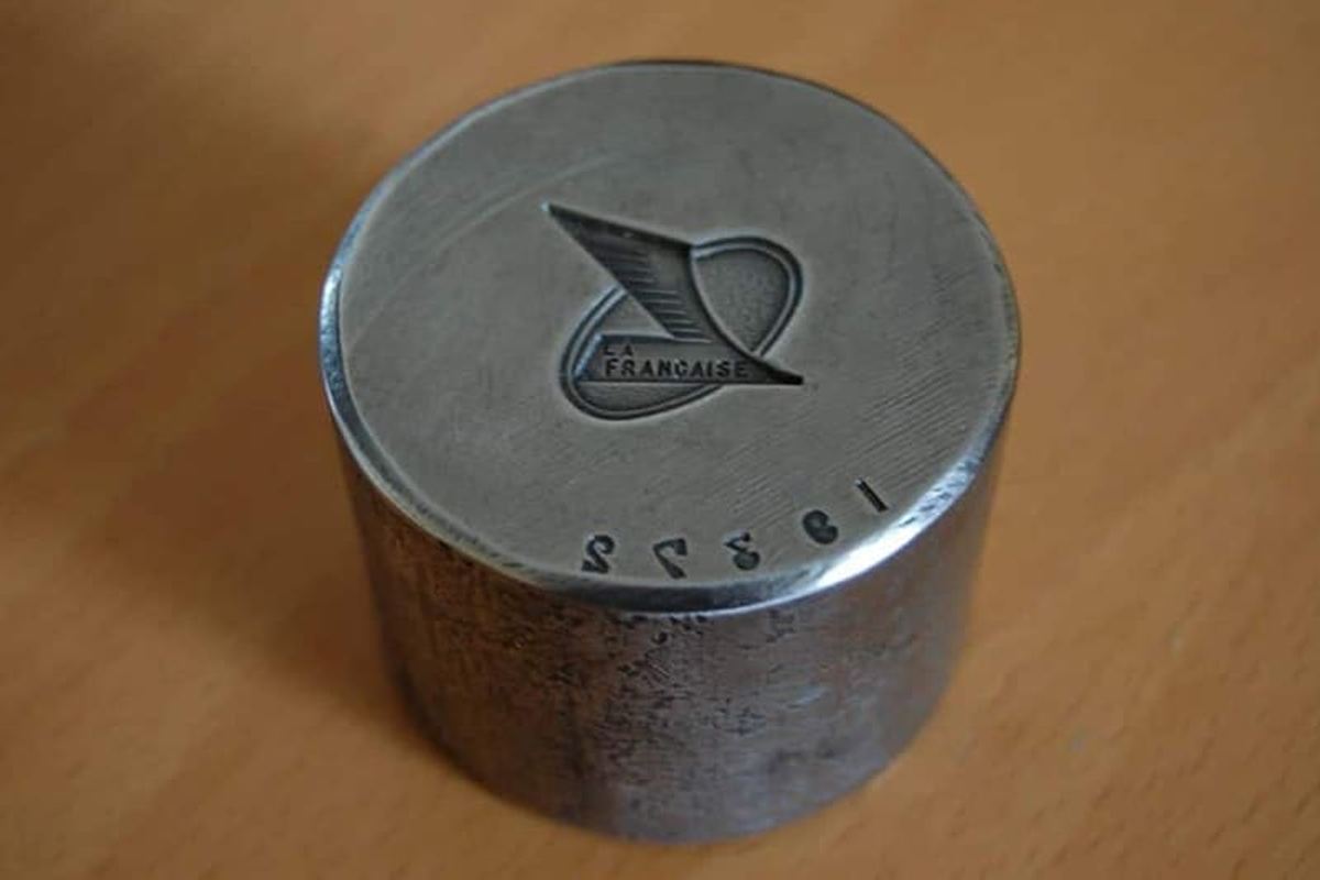 A stamping die punch with an embossed logo