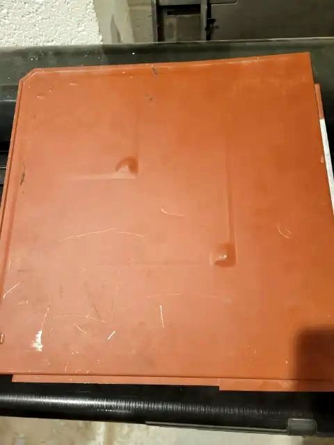 A single Dragon Armor metal shingle, blanked and dimpled by Frontier, with the edges folded ready for the roof
