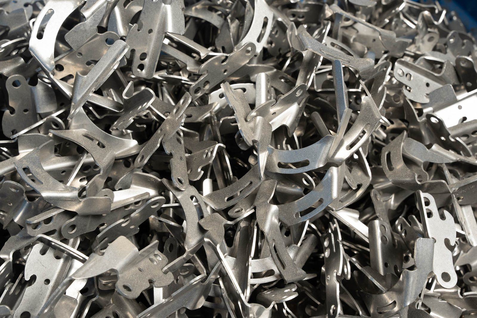 A bin of stamped and formed brackets