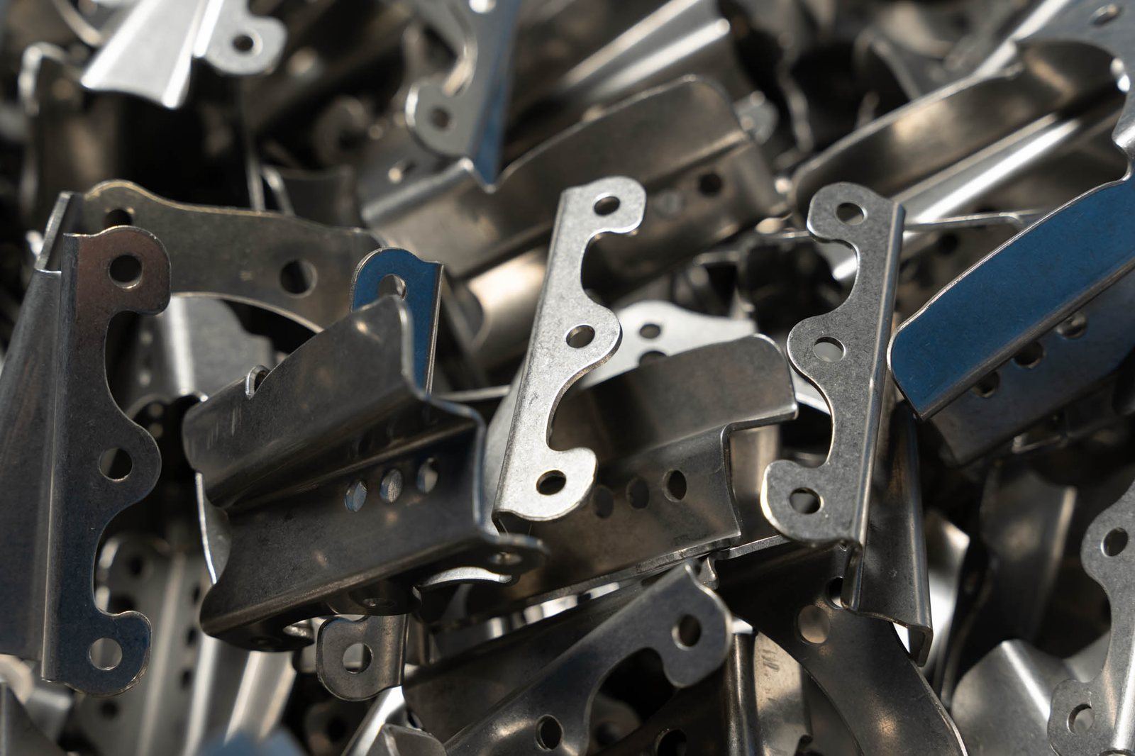 Stamped brackets in bulk after production