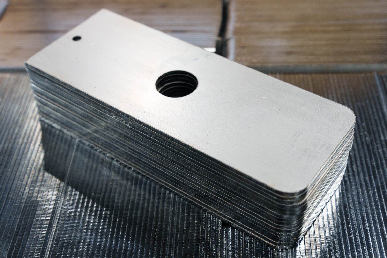A stack of stamped flat plates